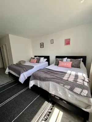 two beds sitting in a room withskirts at #310 Sunny Isles Ocean Reserve with FREE Parking include in Sunny Isles Beach