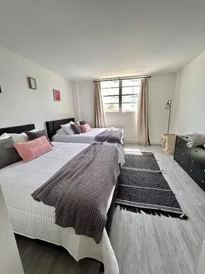 a bedroom with two beds and a window at #310 Sunny Isles Ocean Reserve with FREE Parking include in Sunny Isles Beach