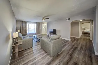 a living room with two couches and a television at Mahalo Isles Apartments by Rocketstay in Fort Lauderdale
