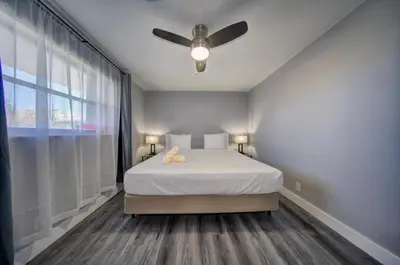 a bedroom with a bed and a ceiling fan at Mahalo Isles Apartments by Rocketstay in Fort Lauderdale