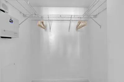 a room with a white wall and a shelf on the ceiling at Lovely Studio in brickell -2 beds and Free parking in Miami