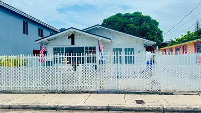 a white fence in front of a white house at B1 Best Value on Private Bedroom with Private Bathroom in Little Havana, Miami in Miami