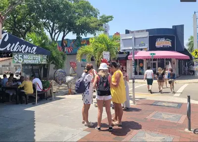 a group of people standing on a city street at B3 Best Value on Private Bedroom with Private Bathroom in Little Havana, Miami in Miami