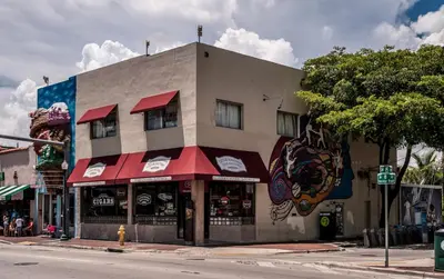 a building on the corner of a street at B4 Best Value on Private Bedroom with Private Bathroom in Little Havana, Miami in Miami