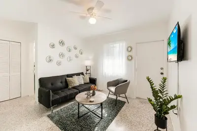a living room with a couch and a table at Vibrant Little Havana Apt with Parking in Miami
