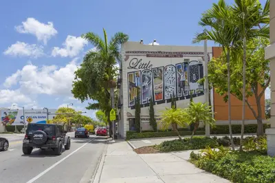 a building with a mural on the side of it at Vibrant Little Havana Apt with Parking in Miami
