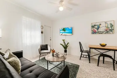 a living room with a couch and a table at Vibrant Little Havana Apt with Parking in Miami