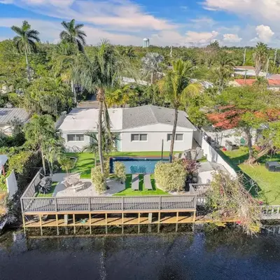 Modern home w heated pool canal views