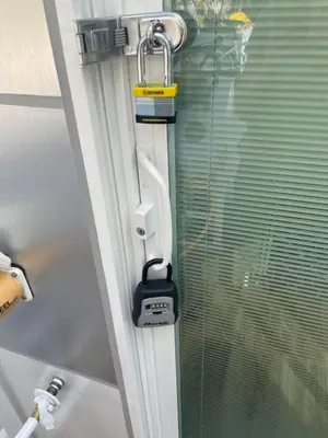 a close up of a door with a clamp on a window at Unique Houseboat Modern and New in Fort Lauderdale