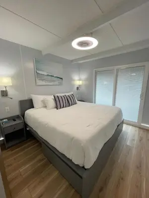 a bedroom with a large bed in a room at Unique Houseboat Modern and New in Fort Lauderdale