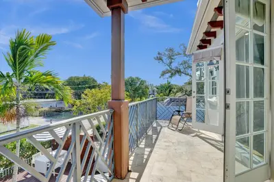 a balcony with a view of the ocean at Tarpon River House - Heat Optional Pool - 4 bedrooms - 3 bathrooms - 1 miles to downtown FTL in Fort Lauderdale