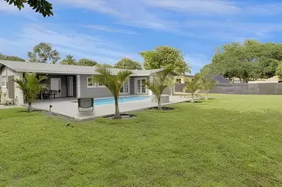 a house with a swimming pool in a yard at Luxury Miami Villa in North Miami