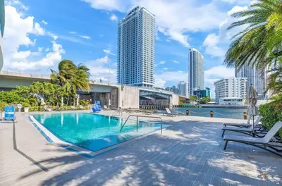 a swimming pool with a view of the city at Top Floor Luxury Penthouse with Private Roof Deck in Hallandale Beach