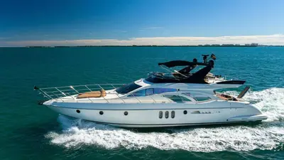 a white boat in the middle of the water at Top Floor Luxury Penthouse with Private Roof Deck in Hallandale Beach