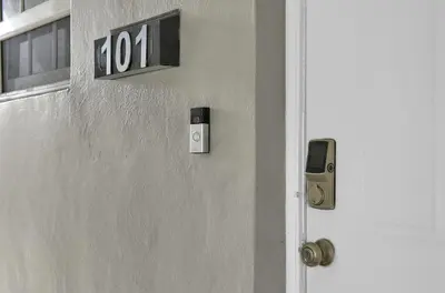 a door with a hotel sign and a cell phone at Dolce Vita Hideaway Pool House by Pako Stays in Miami