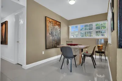 a dining room with a table and chairs at Dolce Vita Hideaway Pool House by Pako Stays in Miami
