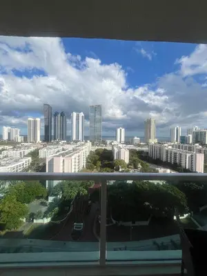a view of a city skyline from a balcony at Enjoy an endless summer - Parking included! in Sunny Isles Beach