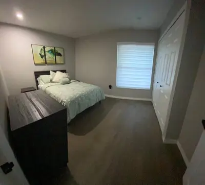 a bedroom with a large bed and a window at Cozy 2 Bedroom Modern Farmhouse in Miami in Tamiami