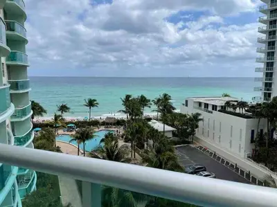 a view of the ocean from the balcony of a resort at 7th FL Ocean view spacious 1 bedroom in Hollywood