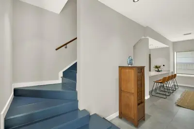 a staircase in a house with a blue stair case at Stunning Home LifeStyle Miami in Miami