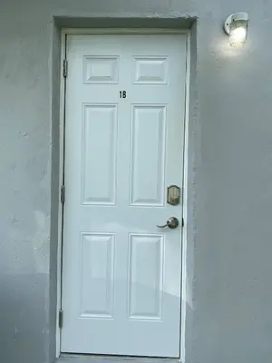 a white door with the number on it at Annas Peaceful mini Luxury suite in Fort Lauderdale