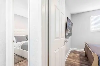 a door leading to a bedroom with a bed at Mazor Luxury Two bedroom vacation Home in Fort Lauderdale