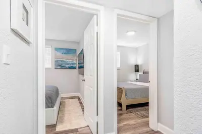 a room with a bedroom with a bed and a doorway at Mazor Luxury Two bedroom vacation Home in Fort Lauderdale