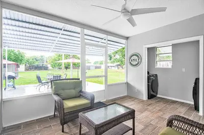 a living room with a couch and chairs and a table at Rachaels Upscale Two Bedrooms Luxury Home in Fort Lauderdale