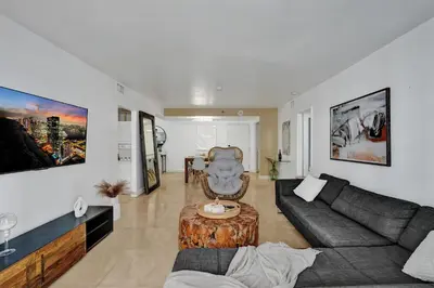 a living room with a couch and a table at Cozy Beachfront 2 BDR Miami Beach Condo 1114 in Miami Beach