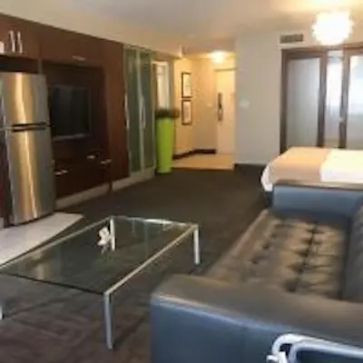 a hotel room with a couch and a coffee table at Congress Ocean Drive in Miami Beach