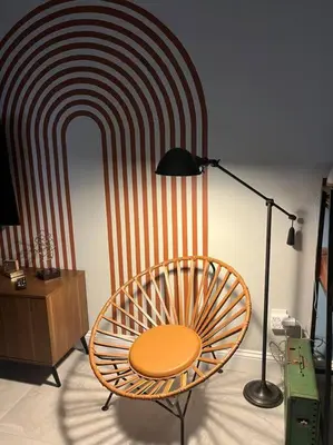 a chair sitting in front of a wall with a red and white stripes at The Brickell Hideout - Charming/Cozy/Central in Miami