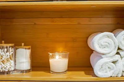 a shelf with a glass of milk and towels at The Brickell Hideout - Charming/Cozy/Central in Miami