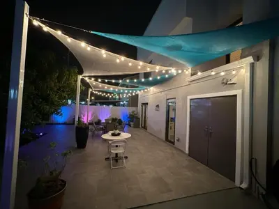 a hallway with a table and lights on a building at Westchester Garden in Miami