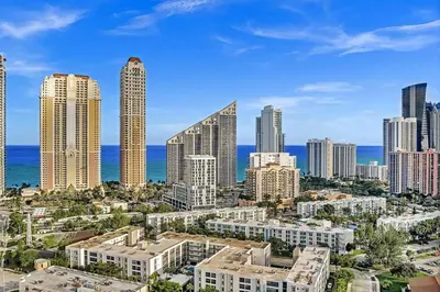 a view of a city skyline with tall buildings at One Bedroom Steps Away From The Beach! in Sunny Isles Beach