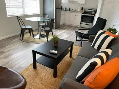 a living room with a couch and a table at Fully equipped Apartments with parking near Cocowalk in Miami