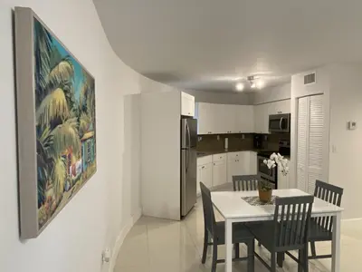 a kitchen and dining room with a table and chairs at Apartments Little Habana near calle 8 in Miami