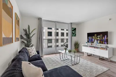 a living room with a couch and a table at Brickell Key Gem: Stylish 1-Bed W/ Free Parking in Miami