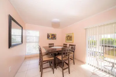 a dining room with a table and chairs at Enjoy Fully Equipped 2BR Condo Near The Beach in Sunny Isles Beach