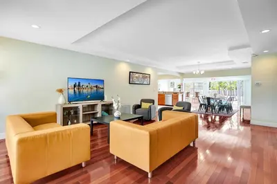 a living room with two couches and a tv at Best Area Spacious 4BR Heated Pool Mins To Beach in Hollywood