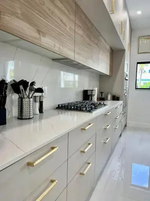 a kitchen with white cabinets and a stove at Elements Las Olas w Pool and Spa Near Beach in Fort Lauderdale