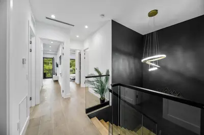 a hallway of a home with a black wall at Elements Las Olas w Pool and Spa Near Beach in Fort Lauderdale