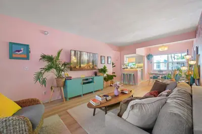 a living room with a couch and a table at Apartamento justo en la playa in Hollywood