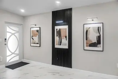 a room with three pictures on a wall at Miami Luxury Home Rental in Miami
