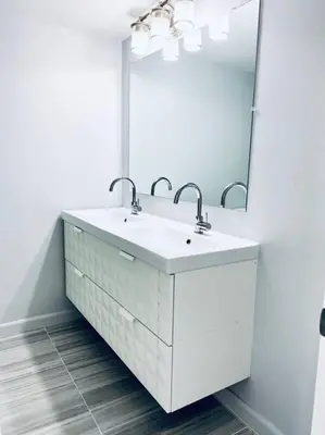 a white bathroom with a sink and a mirror at MODERN 2BR 2BA CONDO near AVENTURA! Wi-Fi! Parking in North Miami Beach