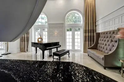 a living room with a piano and a couch at AK414- Miami Beach Apt at Oceanfront Resort in Miami Beach