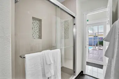 a bathroom with white towels and a shower at Hollywood Villa Luxury & Private Pool in Hollywood