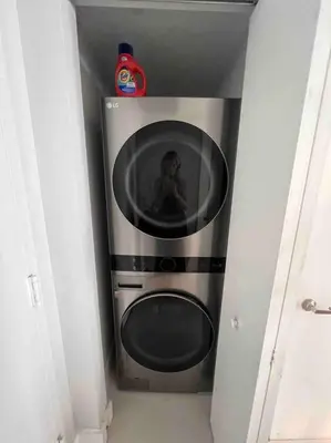 a person taking a picture of a microwave in a room at Luxury condo in Icon W hotel Brickell in Miami