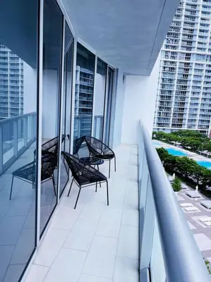 two chairs on a balcony in a building at Luxury condo in Icon W hotel Brickell in Miami