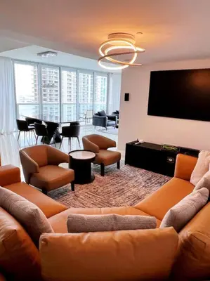 a living room with a couch and a flat screen tv at Luxury condo in Icon W hotel Brickell in Miami
