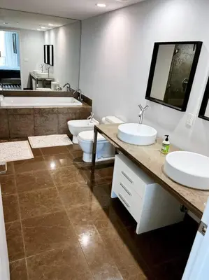 a bathroom with two sinks and a tub and two toilets at Luxury condo in Icon W hotel Brickell in Miami